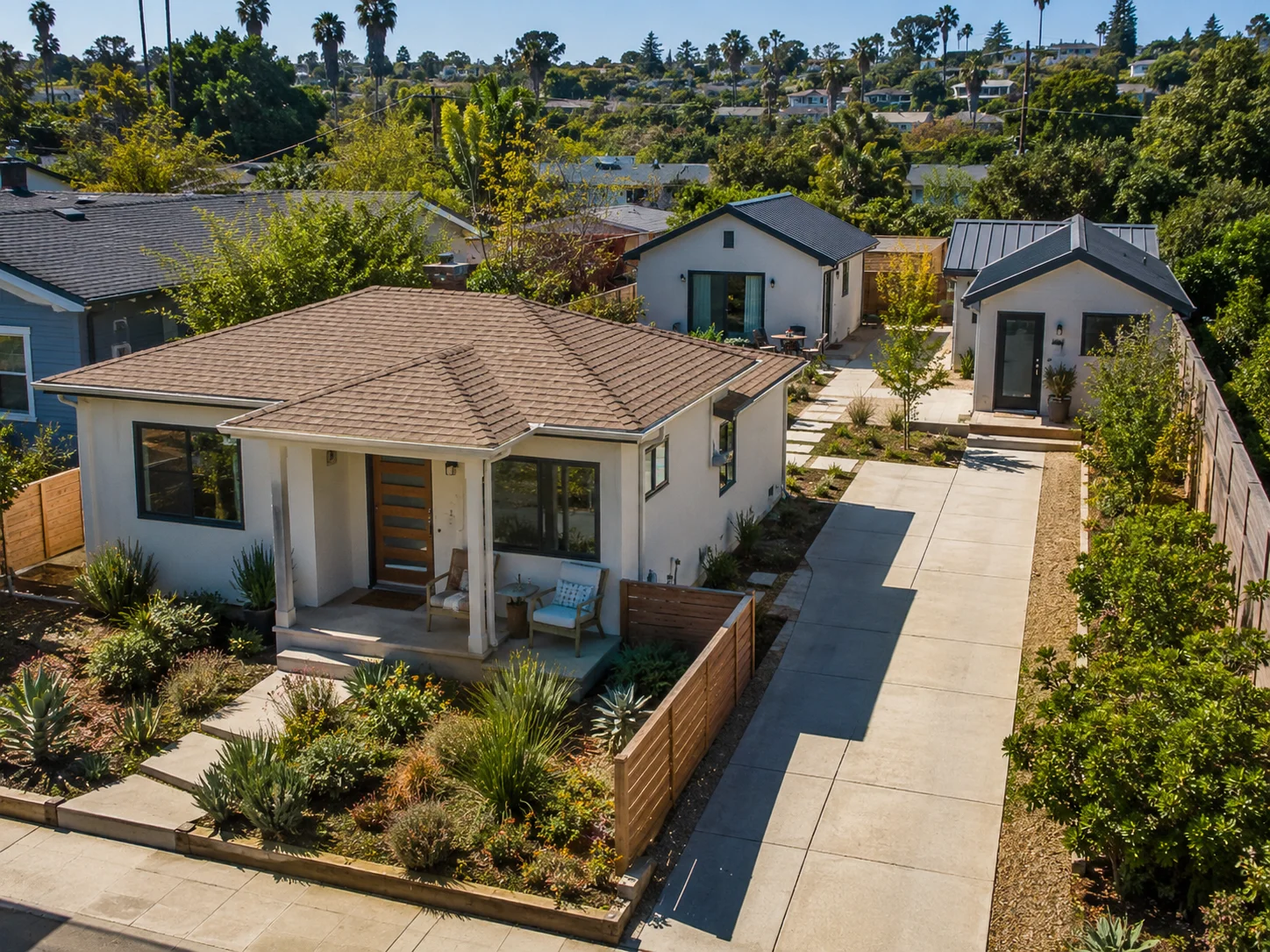 Aerial view of a City of San Diego residential lot showing a primary home plus two ADUs \u2014 the type of multi-unit configuration the San Diego ADU Bonus Program enables on eligible parcels